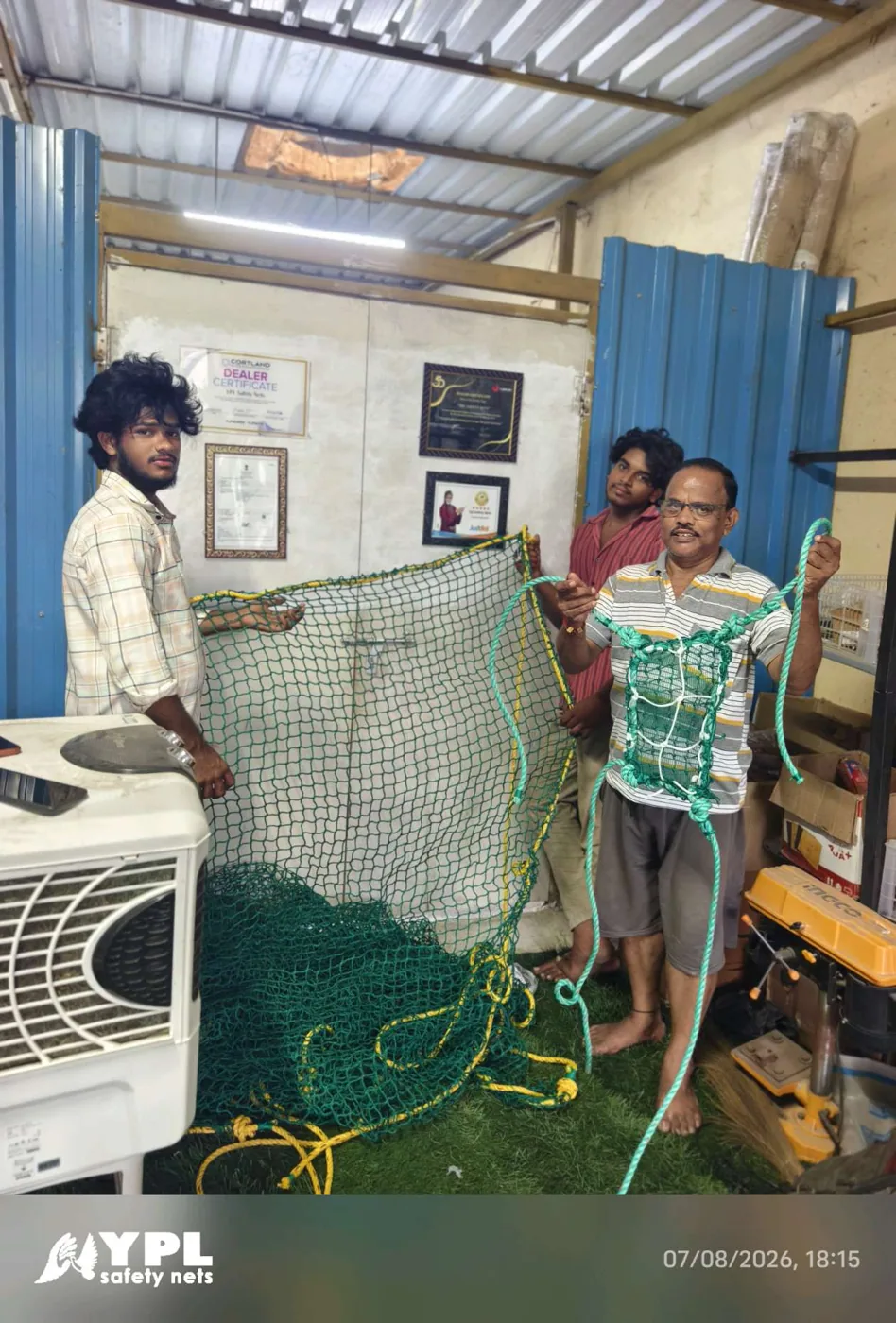YPL Safety Nets team inspecting a construction safety net panel before dispatch in Chennai