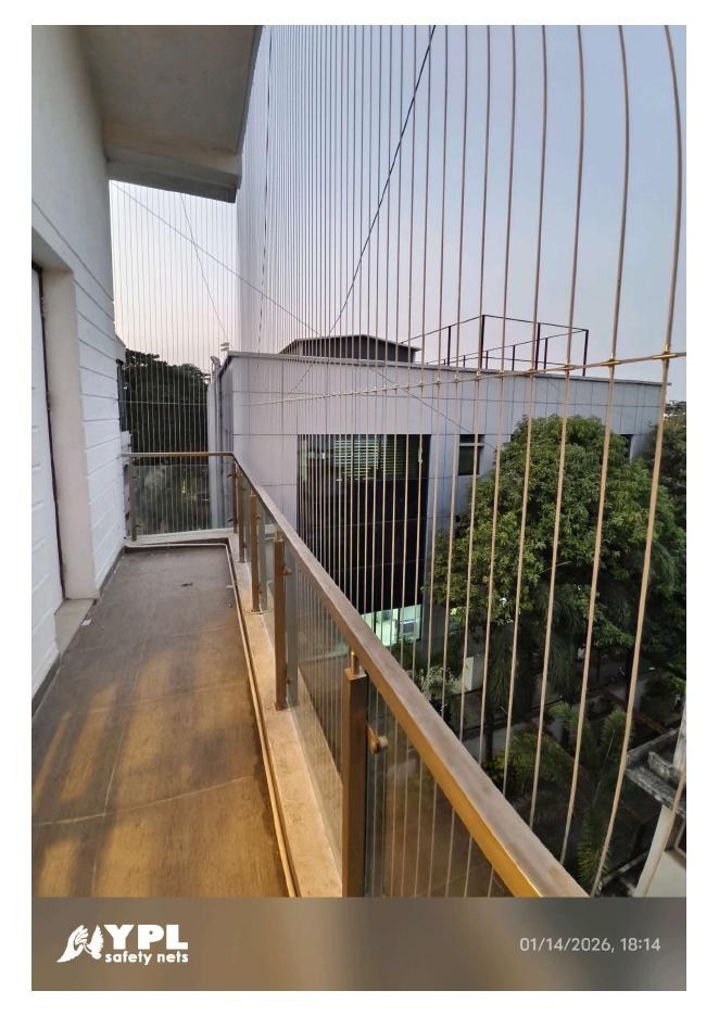 Invisible grill installed on a Chennai apartment balcony by YPL Safety Nets Invisible grill installed on a Chennai apartment balcony by YPL Safety Nets
