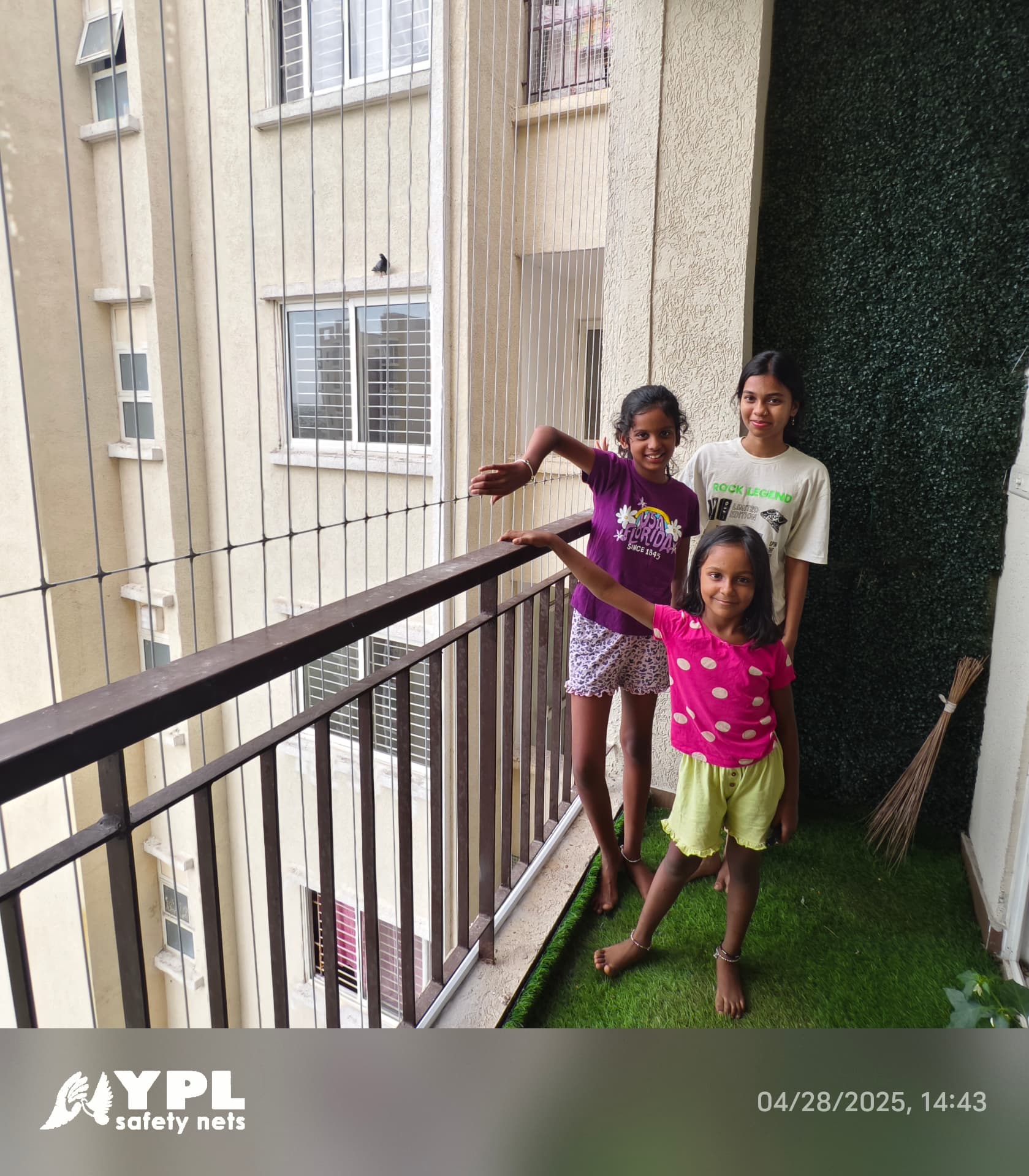 Children standing safely on a balcony behind a cable safety grill in Chennai