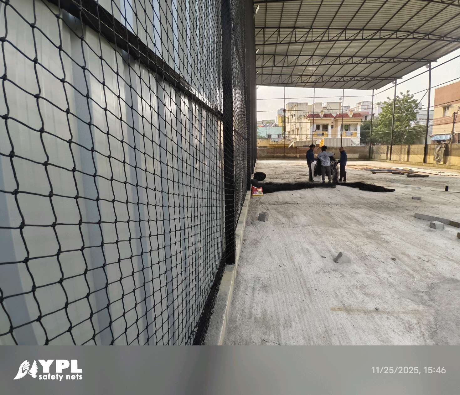 Large industrial sports-net enclosure under construction by the YPL Safety Nets installation team