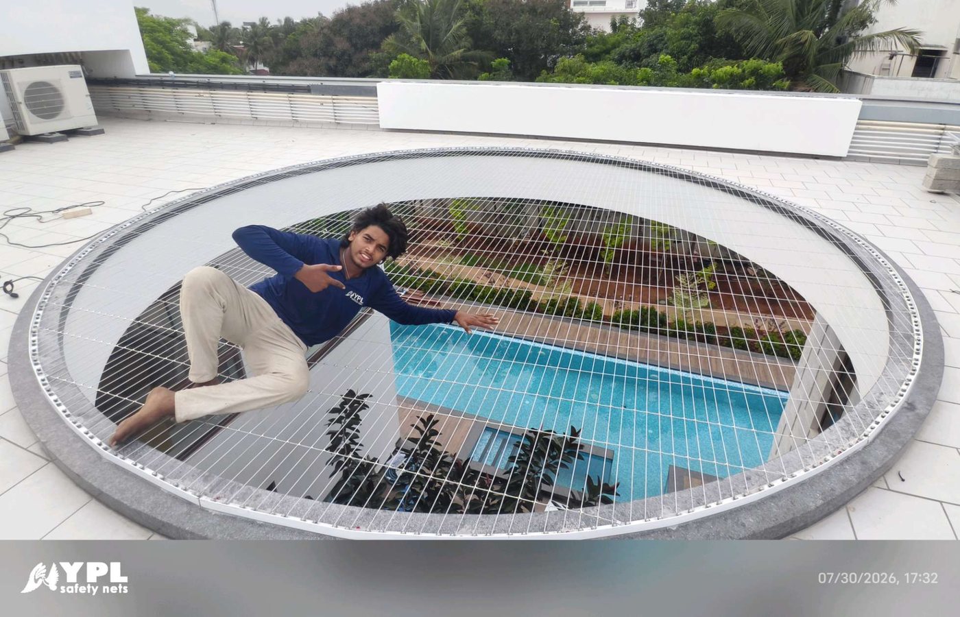 Swimming pool safety net cover stretched over a private pool by YPL Safety Nets
