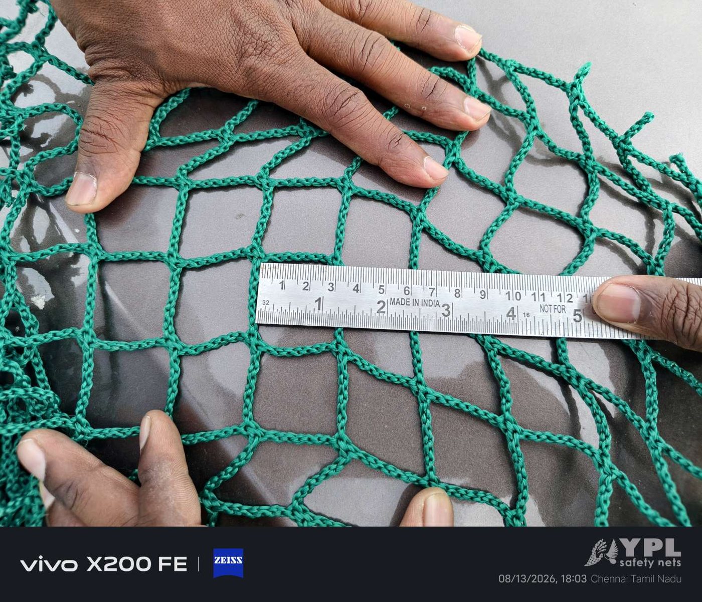 Mesh size of a balcony safety net being measured with a steel scale at YPL Safety Nets Chennai