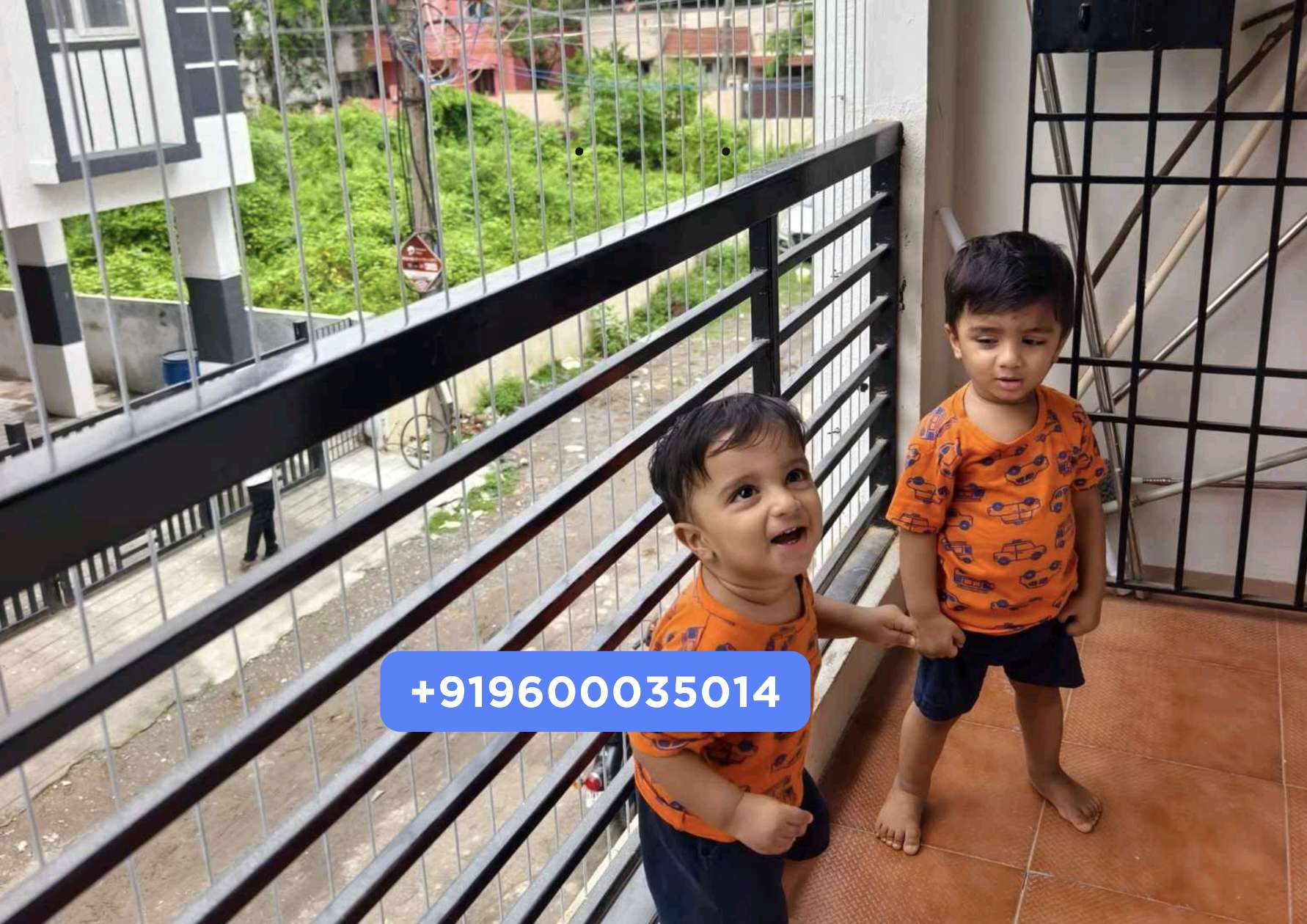 Children standing safely behind a YPL balcony safety net installed in a Chennai apartment