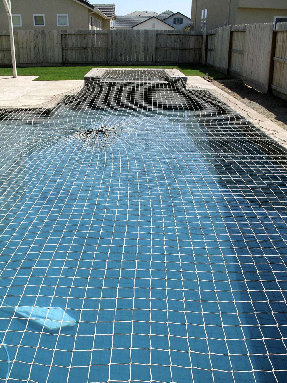 Swimming pool safety net installed across the water by YPL Safety Nets Chennai