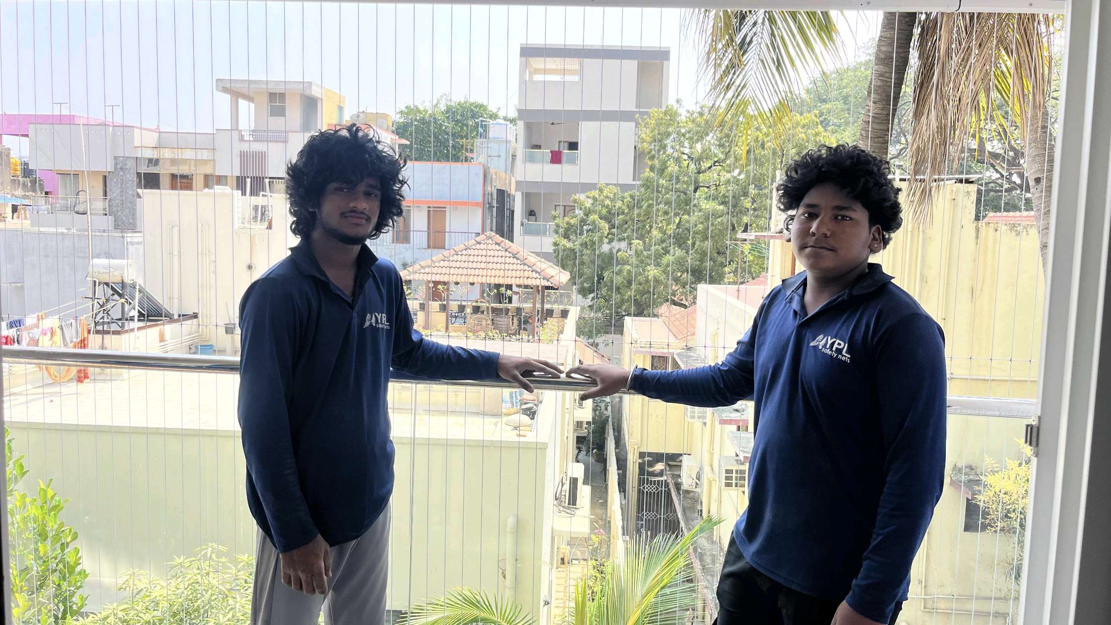 YPL Safety Nets installation team handing over a finished invisible grill project in Chennai
