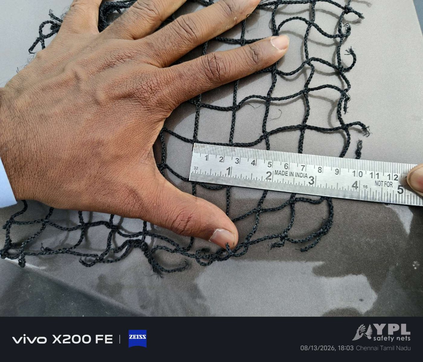 Black safety net mesh measurement — UV-stabilised HDPE balcony net quality check at YPL Safety Nets Chennai