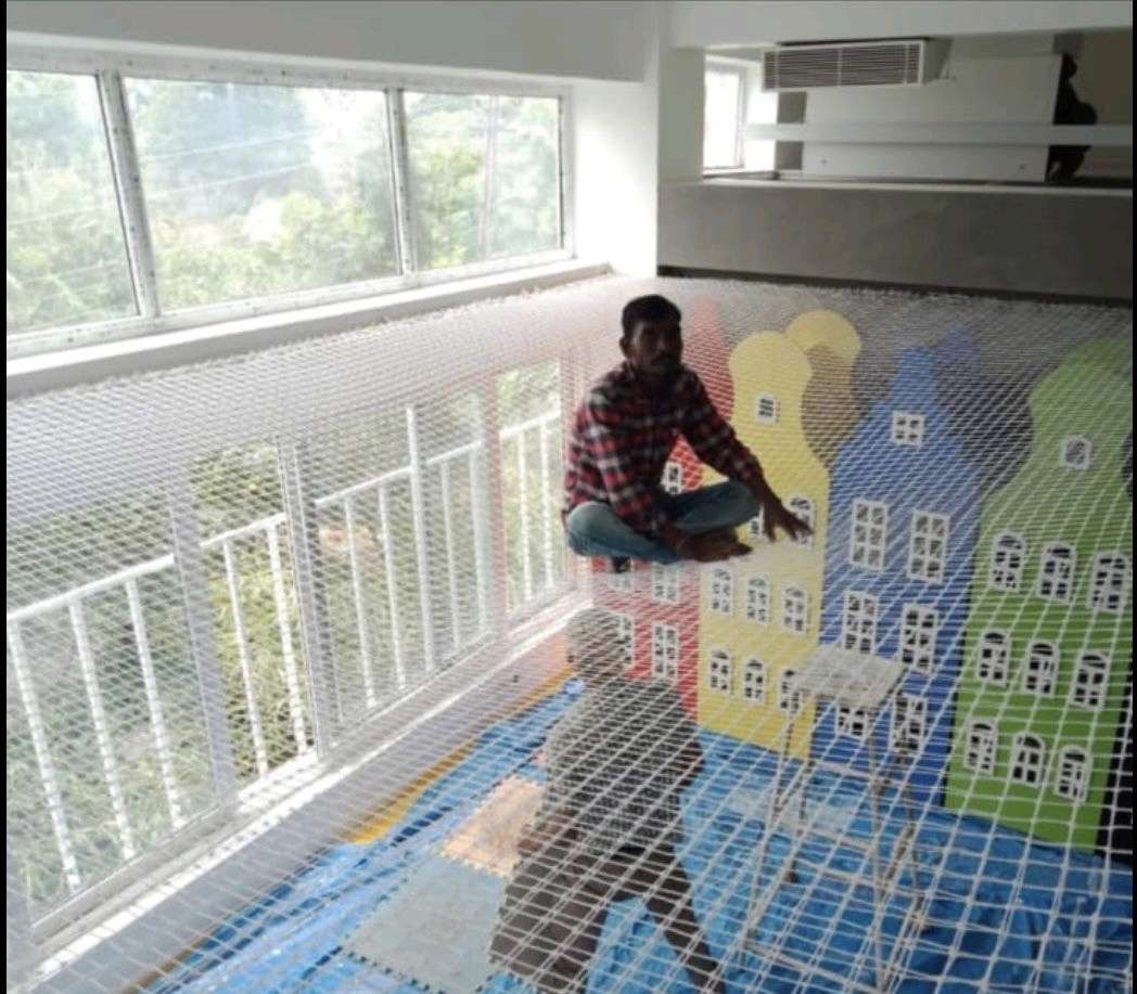 Indoor children play area enclosed with a colourful safety net by YPL Safety Nets Chennai
