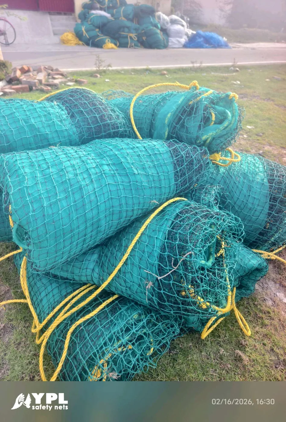 Construction safety net rolls unloaded at a building site in Chennai by YPL Safety Nets