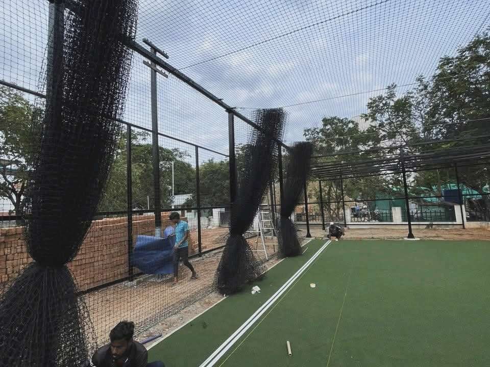 Outdoor artificial turf ground enclosed with sports safety netting by YPL Safety Nets
