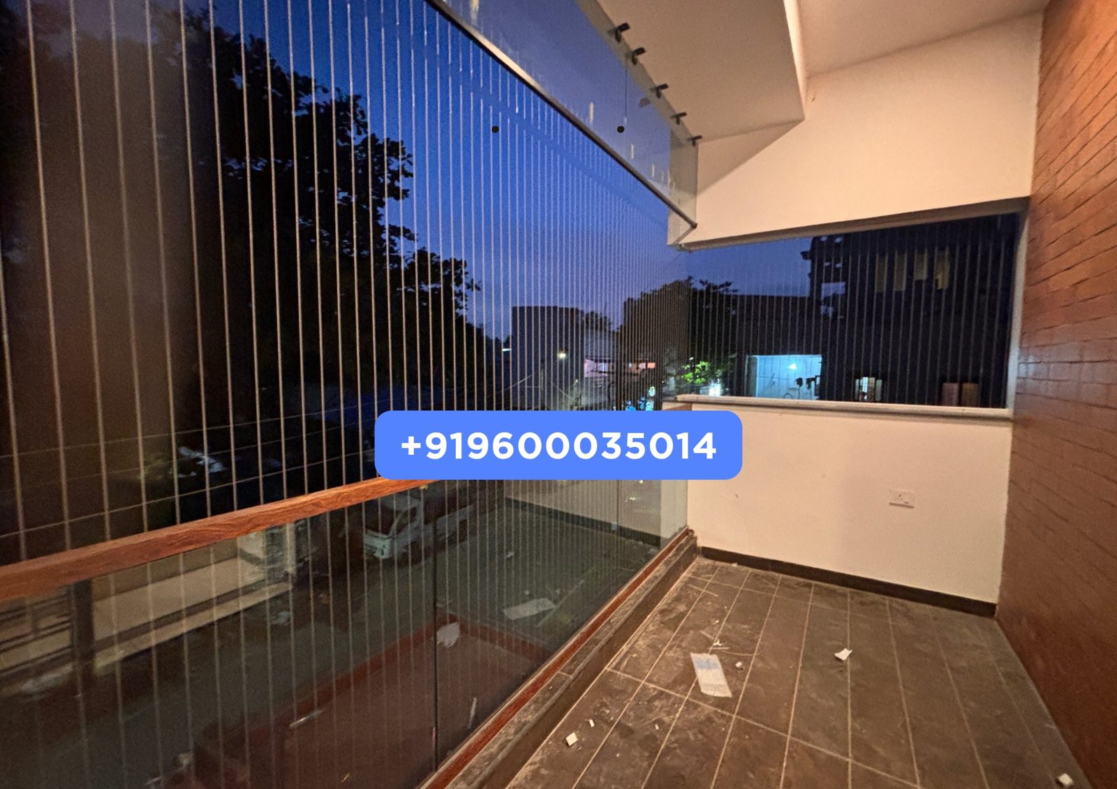 Before: open high-rise balcony on OMR ahead of invisible grill installation