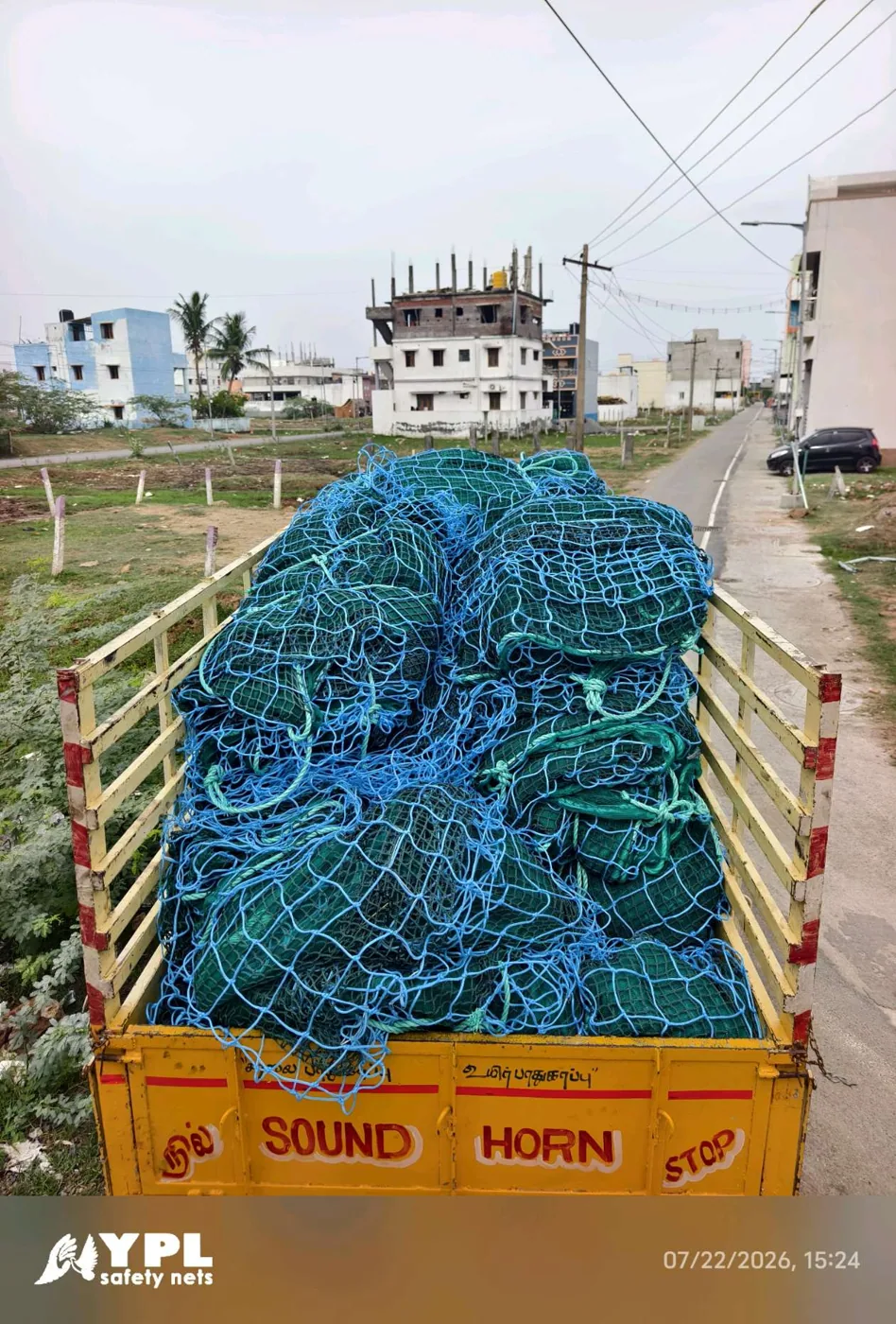 Construction safety nets loaded on a truck for delivery to a Tamil Nadu construction project by YPL Safety Nets