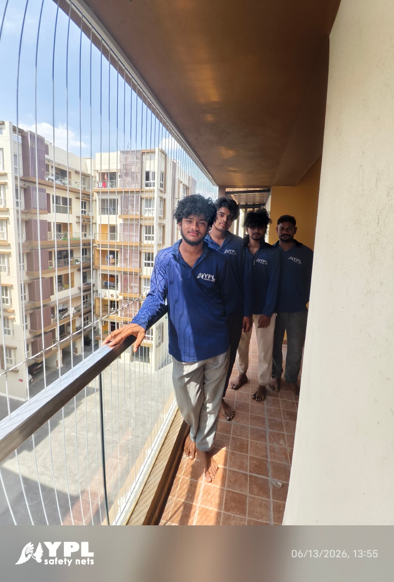 YPL Safety Nets team after completing an SS 316 invisible grill installation on a Chennai balcony - call 9600035014