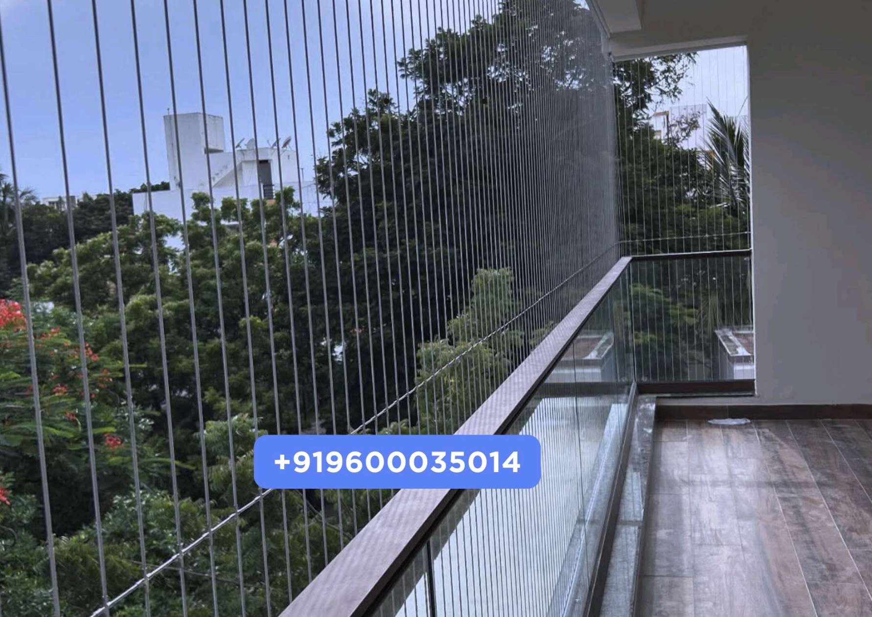 Invisible grille and pigeon net alternative installed on a Chennai apartment balcony by YPL Safety Nets