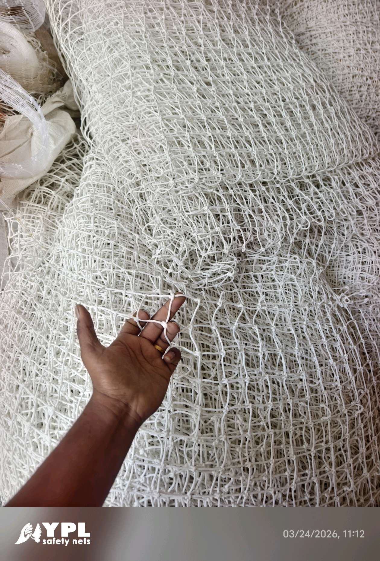 Close view of knots and twine used for ground safety nets