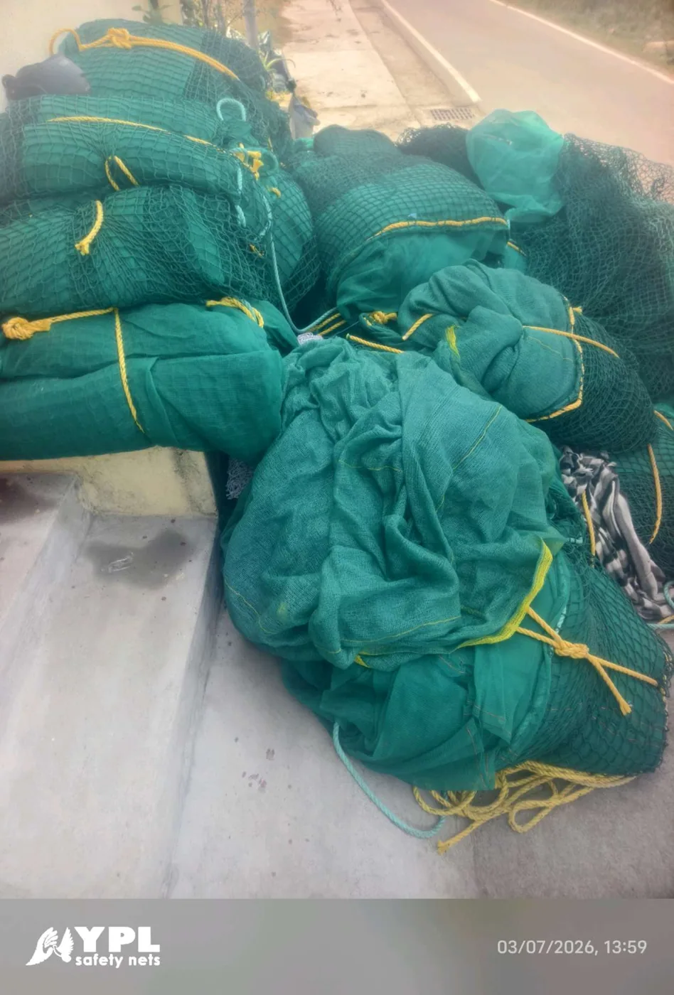 Bundled construction safety nets tied with rope and ready for dispatch by YPL Safety Nets Chennai